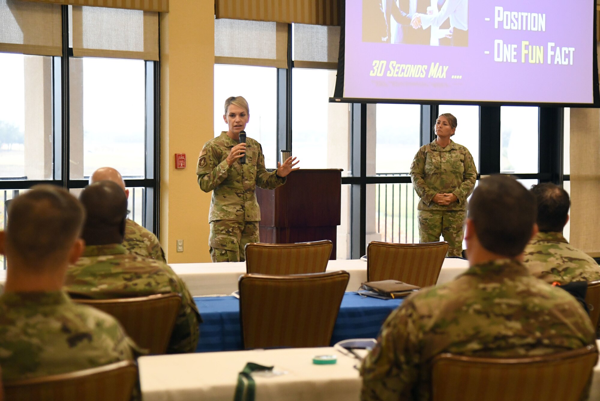 U.S. Air Force Maj. Gen. Michele Edmondson, Second Air Force commander, and Chief Master Sgt. Kathleen McCool, Second Air Force command chief, deliver welcoming remarks to the Second Air Force Technical Training-101 Seminar inside the Bay Breeze Event Center at Keesler Air Force Base, Mississippi, Oct. 25, 2022.