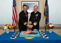 NAVAL BASE KITSAP – BANGOR, Wash. (Oct. 19, 2022) Capt. Gary Montalvo, commodore, Submarine Development Group 5, left, and Adm. Stuart Munsch, commander, U.S. Naval Forces Europe-Africa, cut a cake during a ceremony for a newly-completed service pier located on Naval Base Kitsap – Bangor, October 19, 2022. The ceremony marked the completion of a major infrastructure project that will support the arrival of fast attack submarines, including the planned change of homeport for the Seawolf-class fast-attack submarines USS Seawolf (SSN 21) and USS Connecticut (SSN 22) from Naval Station Kitsap-Bremerton to Naval Base Kitsap-Bangor. (U.S. Navy photo by Mass Communication Specialist 1st Class Brian G. Reynolds)