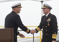 NAVAL BASE KITSAP – BANGOR, Wash. (Oct. 19, 2022) Capt. Gary Montalvo, commodore, Submarine Development Squadron 5, left, shakes hands with Adm. Stuart Munsch, commander, U.S. Naval Forces Europe-Africa during a ribbon cutting ceremony for a newly-completed service pier located on Naval Base Kitsap – Bangor, October 19, 2022. The ceremony marked the completion of a major infrastructure project that will support the arrival of fast attack submarines, including the planned change of homeport for the Seawolf-class fast-attack submarines USS Seawolf (SSN 21) and USS Connecticut (SSN 22) from Naval Station Kitsap-Bremerton to Naval Base Kitsap-Bangor. (U.S. Navy photo by Mass Communication Specialist 1st Class Brian G. Reynolds)