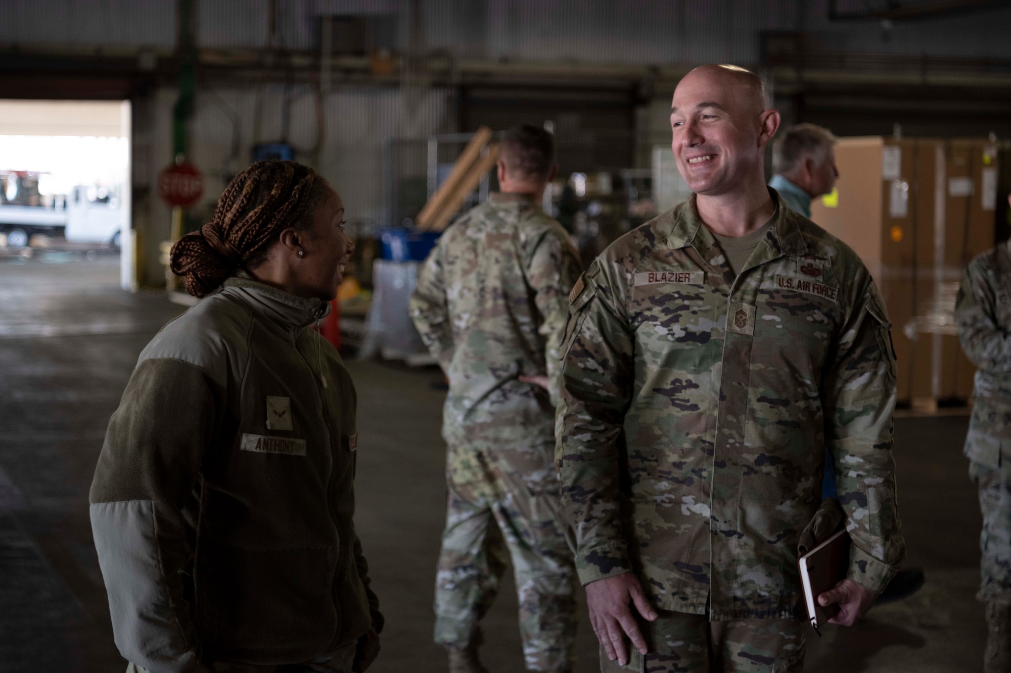 Airmen talk to one another.