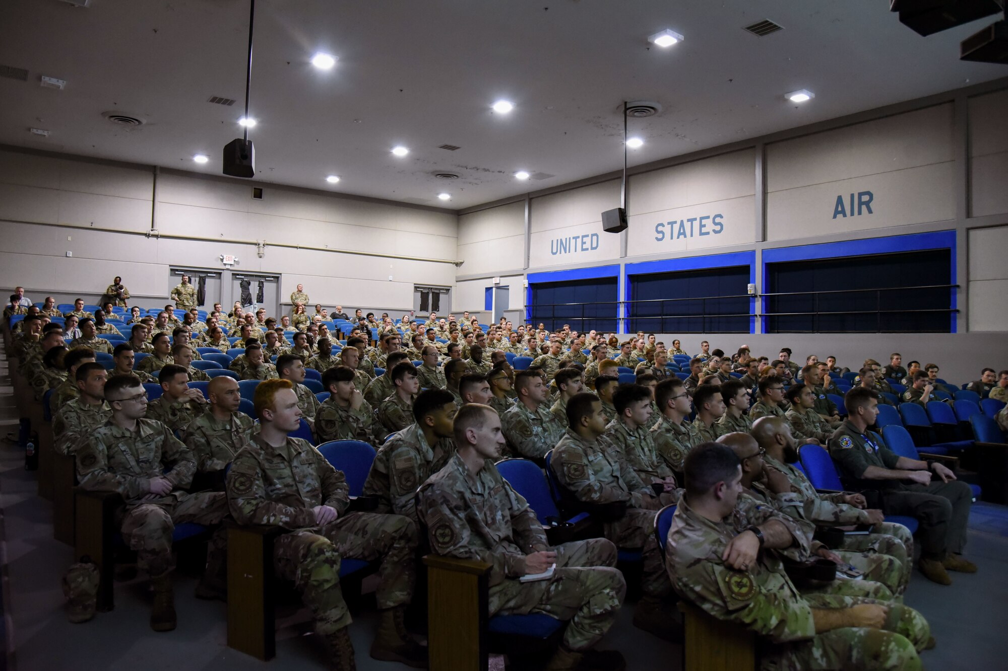 A photo of Airmen sitting.