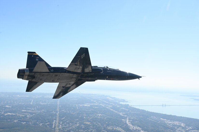 A T-38 Talon from the 7th Fighter Training Squadron pitches out left during the Battle of Britain Commemoration held by the 1st Fighter Wing at Joint Base Langley-Eustis, Virginia, Oct. 21, 2022.  The commemoration consisted of a brief with historical context, assigning crew members with call signs related to key battle participants and flight operations similar to the time of the battle. (U.S. Air Force photo by Tech. Sgt. Matthew Coleman-Foster)