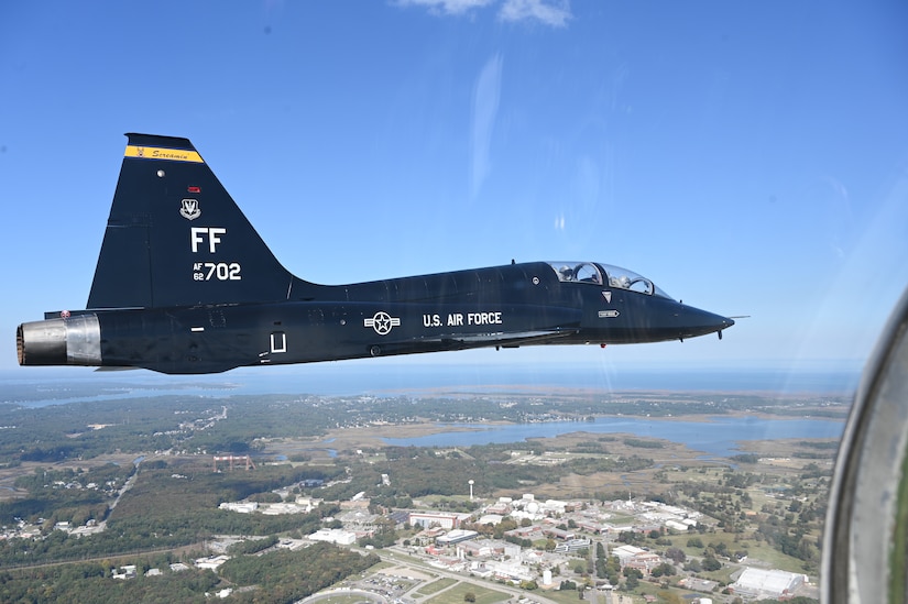 A T-38 Talon from the 7th Fighter Training Squadron returns from conducting a simulated battle commemorating the Battle of Britain held by the 1st Fighter Wing at Joint Base Langley-Eustis, Virginia, Oct. 21, 2022.  The commemoration replicated many aspects of the Battle of Britain such as the participants representing both sides of the battle scrambling to meet an unknown number of adversaries entering their airspace. (U.S. Air Force photo by Tech. Sgt. Matthew Coleman-Foster)