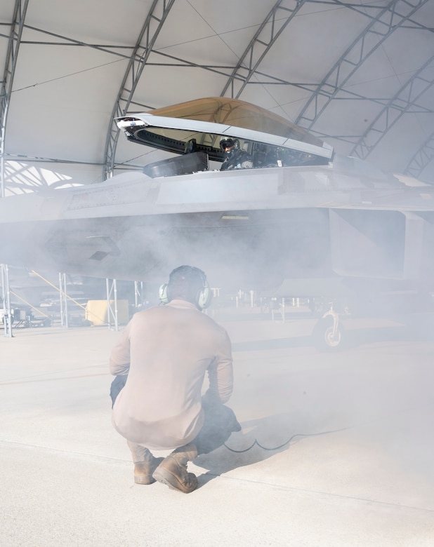 Airman 1st Class Taara Basnet, 94th Fighter Generation Squadron crew chief, stands by as a pilot starts an aircraft in preparation of the Battle of Britain Commemoration held by the 94th Fighter Squadron, Joint Base Langley-Eustis, Virginia, Oct. 21, 2022. During the event, pilots were assigned the roles of acting as British forces defending the British coast while German forces attacked from France. (U.S. Air Force photo by Tech. Sgt. Matthew Coleman-Foster)