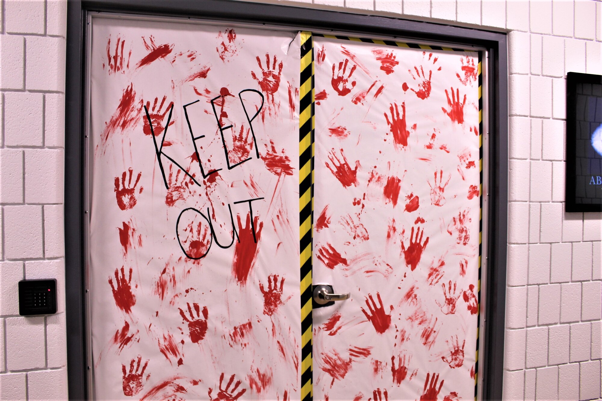 a door with handprints made from red paint