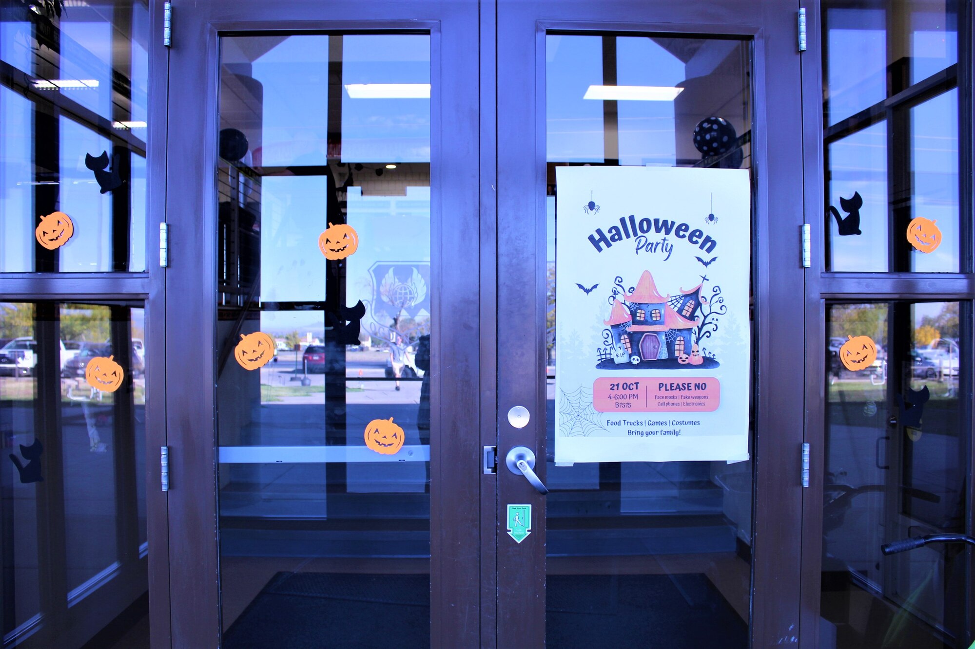 Glass Doors and a Halloween party sign