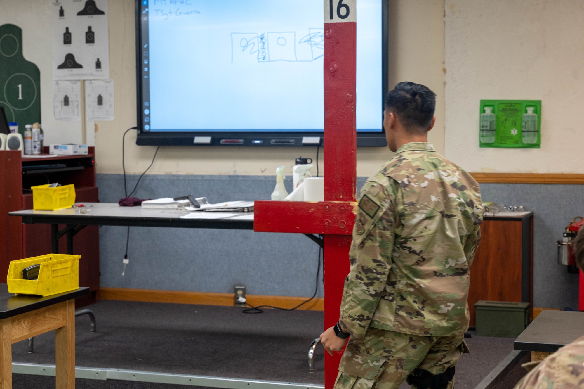 U.S. Air Force Tech. Sgt. Joseluis Guerra, 56th Security Forces Squadron Combat Arms instructor, demonstrates various shooting positions during a qualification course, Oct. 27, 2022, at Luke Air Force Base, Arizona.