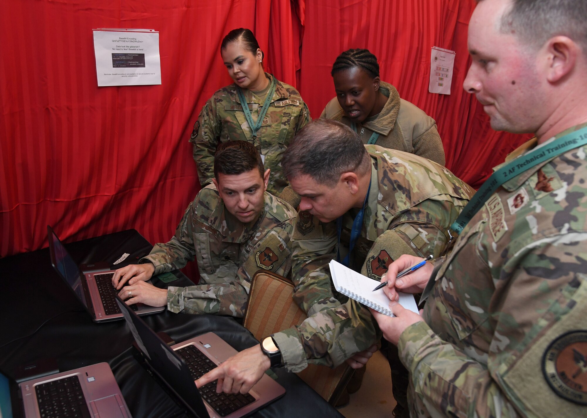 Members of the Inter-American Air Forces Academy, Joint Base San Antonio-Lackland Air Force Base, Texas, participate in the 333rd Training Squadron escape room during the innovation expo during the Second Air Force Technical Training-101 Seminar inside the Bay Breeze Event Center at Keesler Air Force Base, Mississippi, Oct. 25, 2022.