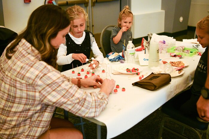 A family participates in an event at the Community Activity Center on Beale Air Force Base, Calif., on Oct. 28, 2022.
