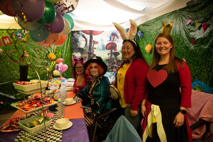 Members from the 9th Medical Group education and training flight pose in an Alice in Wonderland themed room during the 9th MDG’s Halloween event Oct. 28, 2022, at Beale Air Force Base, Calif.