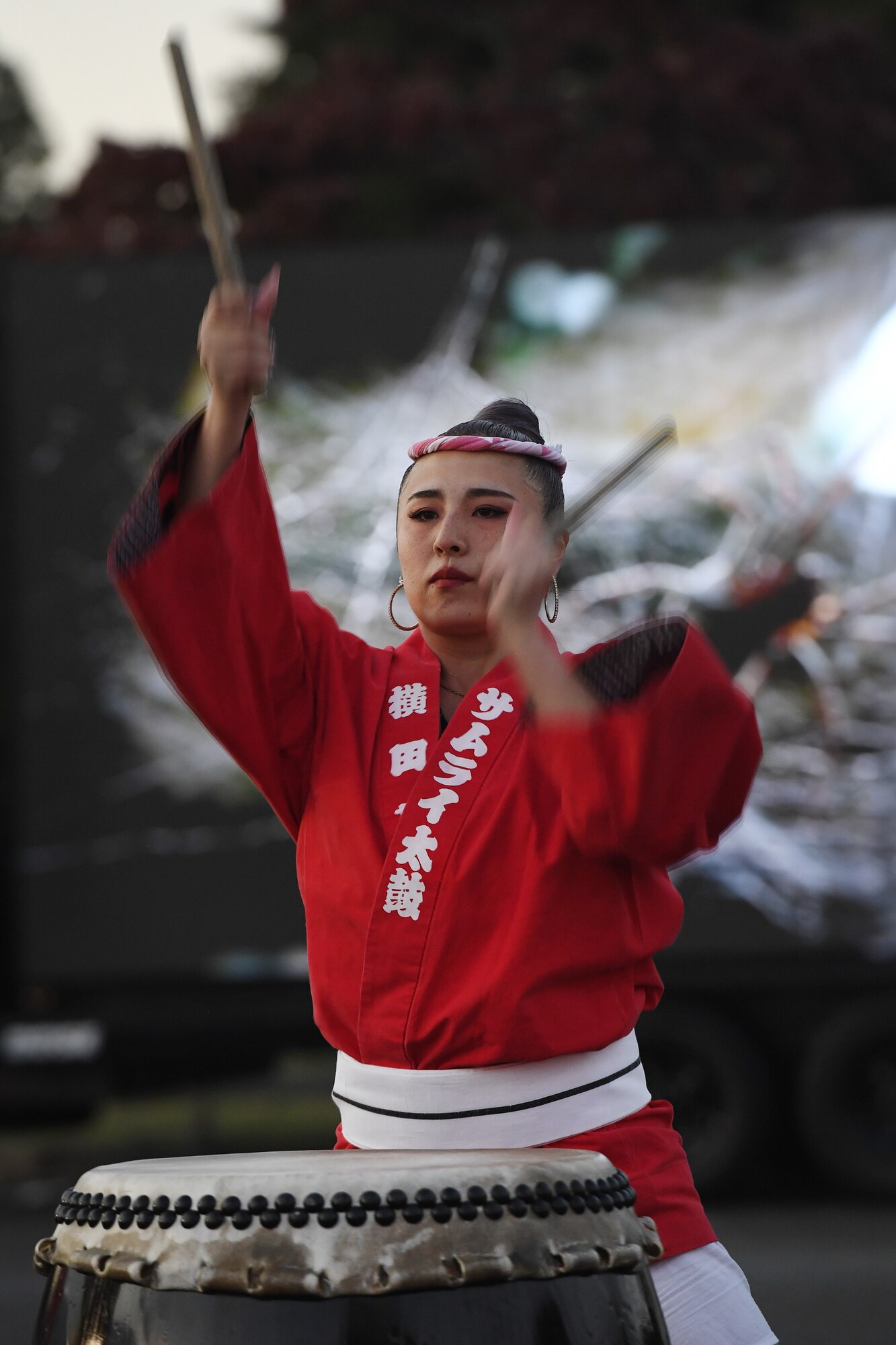 Asami Iwata, Samurai Taiko Drum Team member, performs during a Trunk or Treat Halloween event at Yokota Air Base, Japan, Oct. 28, 2022. Members of the base community were able to trick or treat and enjoy Halloween festivities during the event. Celebrating holidays like Halloween is an opportunity for members of Yokota Air Base to enjoy some time with family and friends. (U.S. Air Force photo by Tech. Sgt. Christopher Hubenthal)