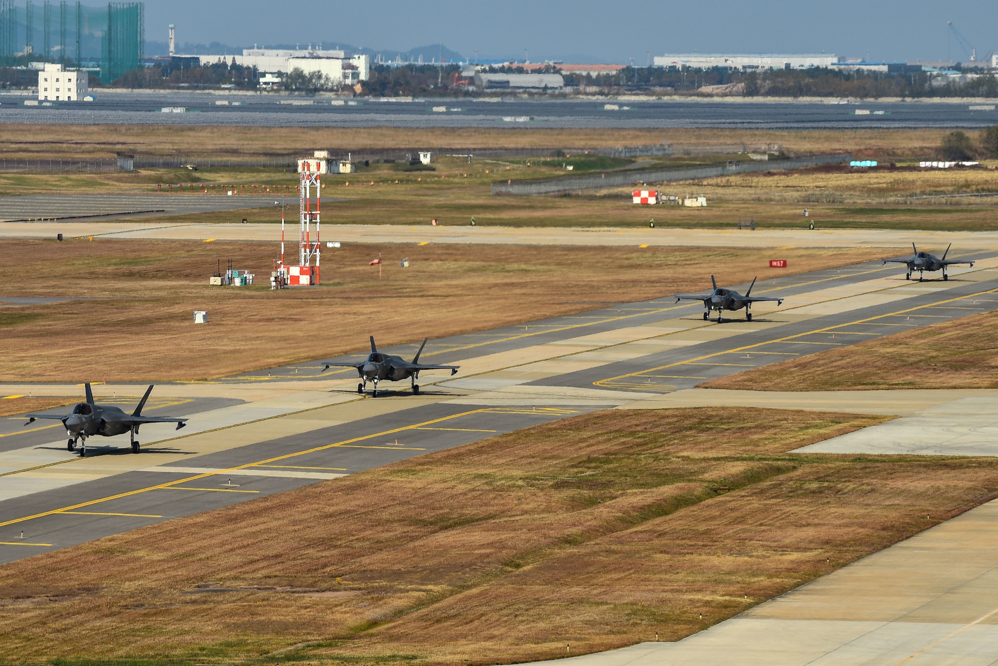 Four U.S. Marine Corps F-35B Lightning II aircraft with Marine Fighter Attack Squadron (VMFA) 242 taxi down the flightline at Kunsan Air Base, Republic of Korea, Oct. 31, 2022. The aircraft traveled to Kunsan as a part of the Pacific Air Forces command sponsored VIGILANT STORM 23 training event. VIGILANT STORM integrates U.S. and ROK forces to train on mutual support procedures and maximizes command and control capabilities to improve understanding and trust between the two nations. (U.S. Air Force photo by Tech. Sgt. Timothy Dischinat)