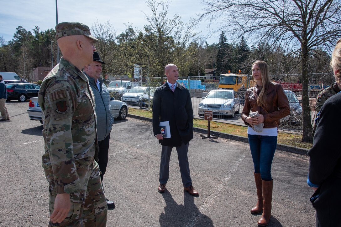 U.S. Army Corps of Engineers, Europe District Regional Program Manager for Air Force Military Design and Construction Program Jennifer Regel, right, discusses the construction of the new Family Housing Management Facility in Vogelweh, Germany April 11, 2022 with project partners, including the then 86th Air Lift Wing Commander U.S. Air Force Brig. Gen. Joshua Olson, left, just before its formal groundbreaking ceremony. The project is an example of one of the many traditional military construction projects Europe District delivers in support of U.S. Air Forces Europe at installations across the continent. (U.S. Army photo by Alfredo Barraza)