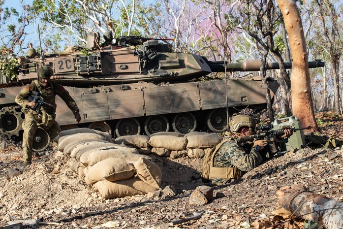 U.S. Marines with Marine Rotational Force-Darwin 22 and Australian Army soldiers secure an objective during exercise Predator's Run 22 at Mount Bundey Training Area, NT, Australia, Aug. 27, 2022. Predator's Run 22 is a multinational exercise that simulates littoral combined arms maneuver in a large-scale force-on-force environment.