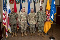 From left, U.S. Marine Corps Sgt. Maj. James Porterfield, North American Aerospace Defense Command and U.S. Northern Command command senior enlisted leader, NORAD and USNORTHCOM Commander U.S. Air Force Gen. Glen D. VanHerck, Joint Task Force Civil Support commanding general, U.S. Army Maj. Gen. Jeffrey P. Van, and U.S. Navy Command Master Chief Kevin Guy, JTF-CS command senior enlisted leader, pose for a photograph in the foyer of JTF-CS headquarters on Fort Eustis, Virginia, Aug. 30, 2022.