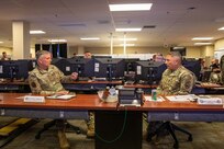 North American Aerospace Defense Command and U.S. Northern Command Commander U.S. Air Force Gen. Glen D. VanHerck, left, and Joint Task Force Civil Support commanding general, U.S. Army Maj. Gen. Jeffrey P. Van, discuss the unit’s ability to deploy in response to a no-notice catastrophic manmade or natural disaster during a visit to JTF-CS headquarters on Fort Eustis, Virginia, Aug. 30, 2022.