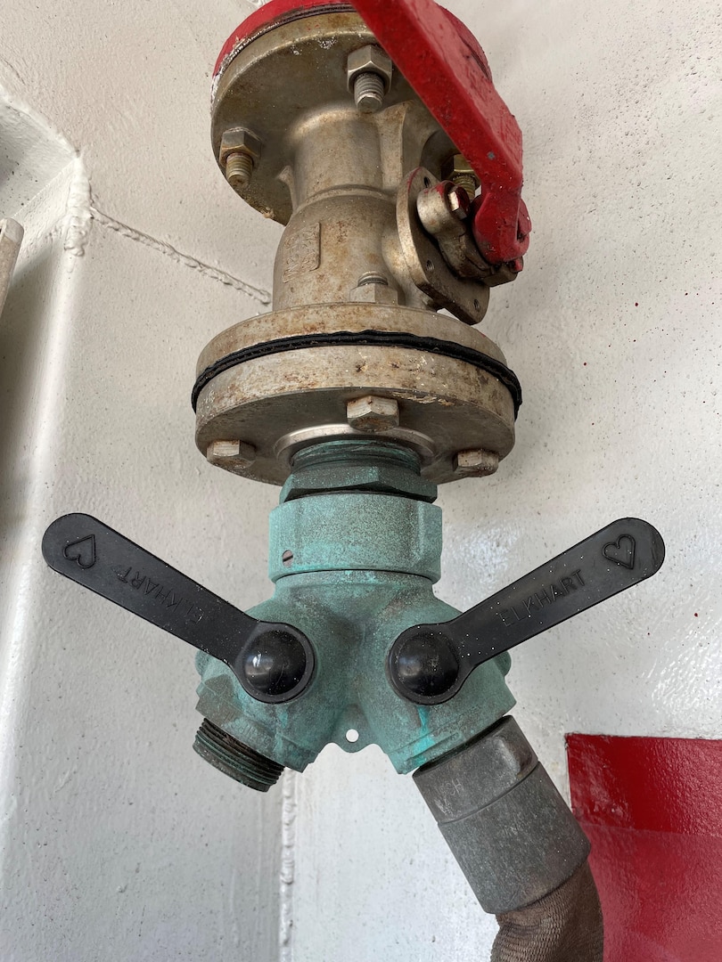 Members serving aboard the Coast Guard Cutter Venturous used a 3D printer to replace broken and cracked handles on the Y-gate, which is a part which allows a fireplug to feed two separate hoses. The handles are used to direct the flow of water. (U.S. Coast Guard photo.)