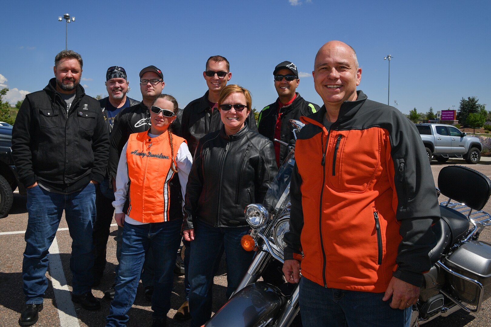 Group of motorcycle riders pose for a photo