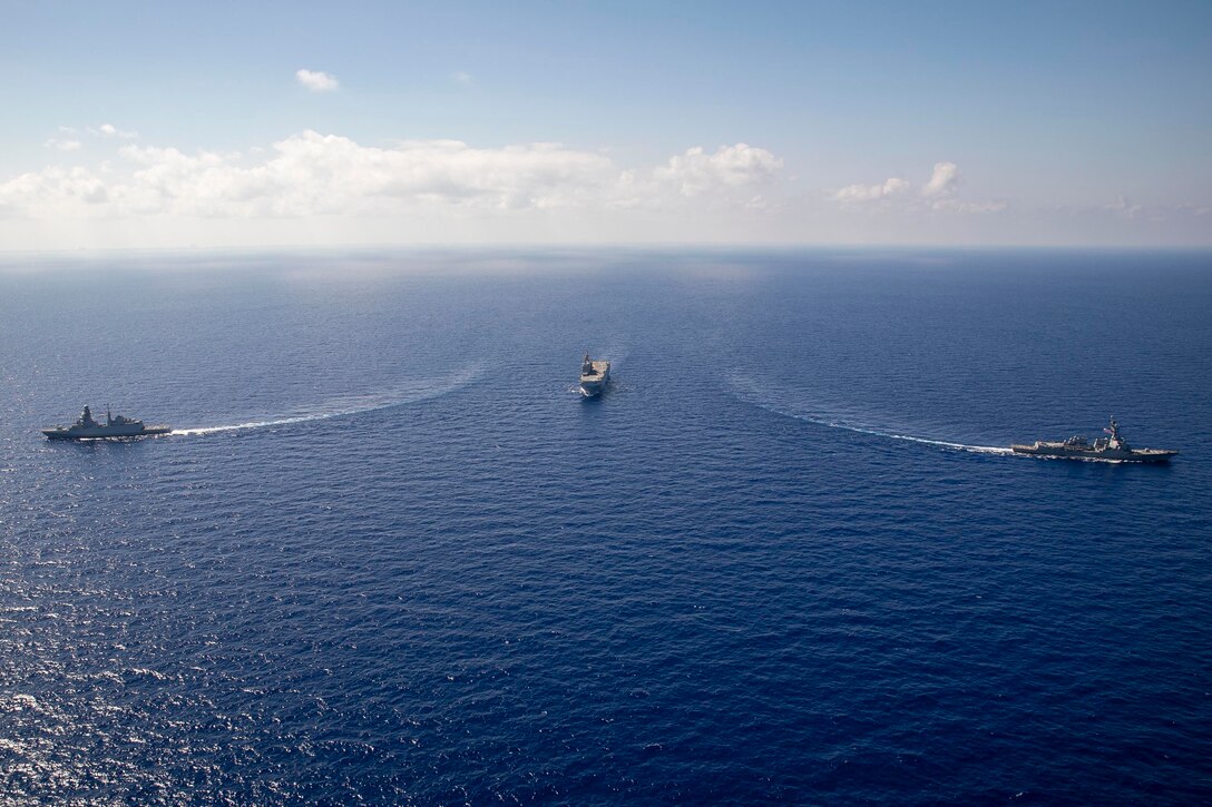 Ships veer off from each other in the ocean.