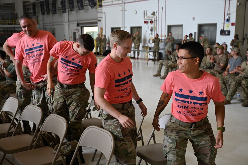 The Air Force District of Washington team  from the 316th Medical Group stands to accept their trophies, as they are named second place finishers overall in the 2022 Medic Rodeo at Cannon Air Force Base, N.M., Aug. 18, 2022. The Medic Rodeo, hosted by the 27th Special Operations Wing, creates a ready medical force by testing the knowledge and skills of medics across the Air Force. (U.S. Air Force photo by 2nd Lt. Brandon DeBlanc)