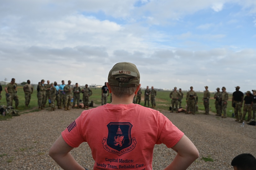 Staff Sgt. Kaylee Miller, 316th Medical Group tactical combat casualty care program manager, listens to the instructional briefing before the Commando Challenge at Cannon Air Force Base, N.M., Aug. 18, 2022. The Commando Challenge is a competition that concludes the Medic Rodeo by having teams race while completing exercises and providing care to their patients. The Medic Rodeo, hosted by the 27th Special Operations Wing, creates a ready medical force by testing the knowledge and skills of medics across the Air Force. (U.S. Air Force photo by 2nd Lt. Brandon DeBlanc)