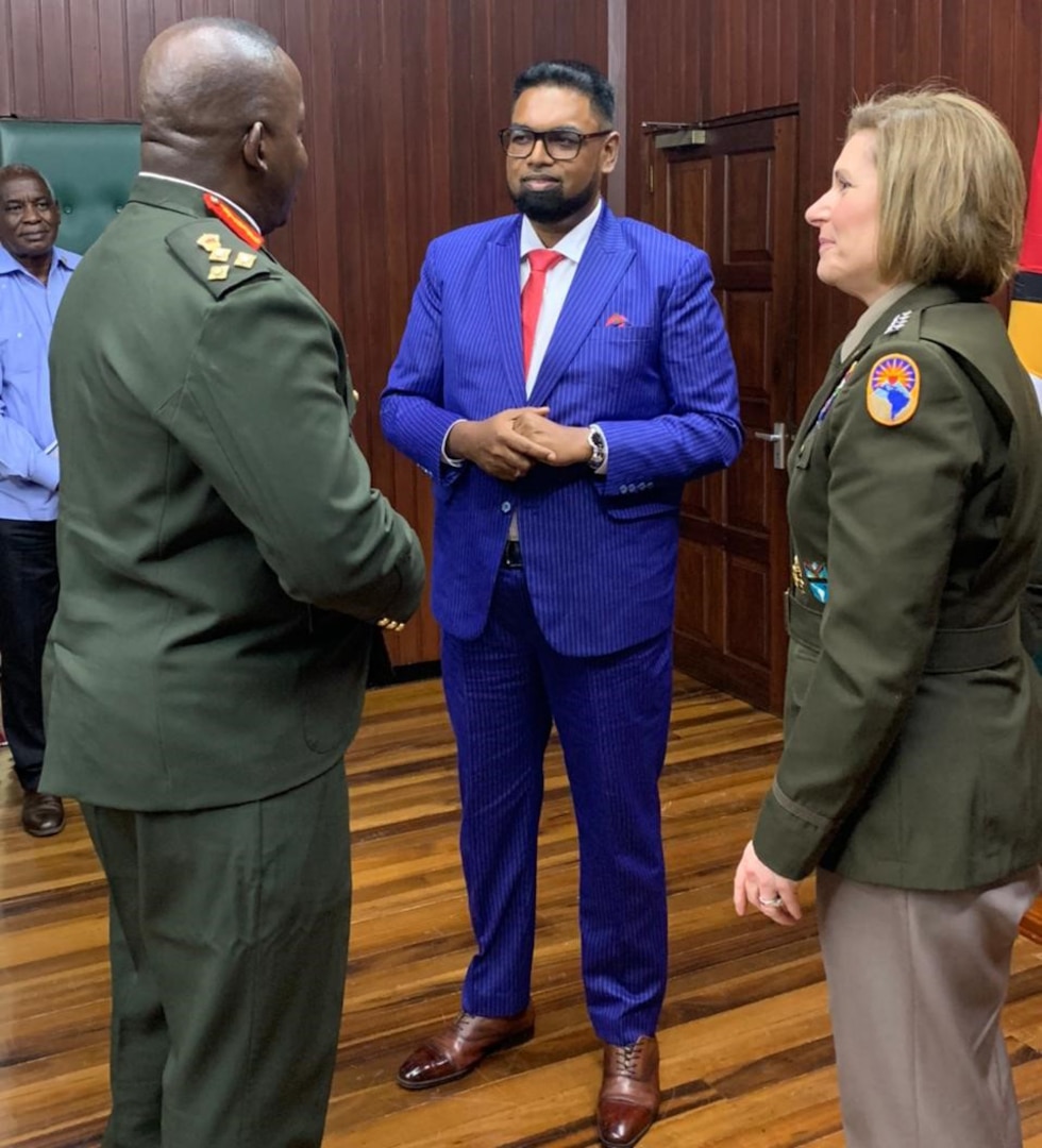 Army Gen. Laura Richardson talks with Guyanese President Dr. Irfaan Ali.