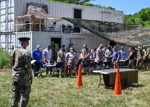 U.S. Air Force Capt. Cliff Kim, 633d Air Base Wing chaplain, delivers an invocation during the start of the 633d Security Forces Squadron combat dining out at Joint Base Langley-Eustis, Virginia, Aug. 26, 2022.