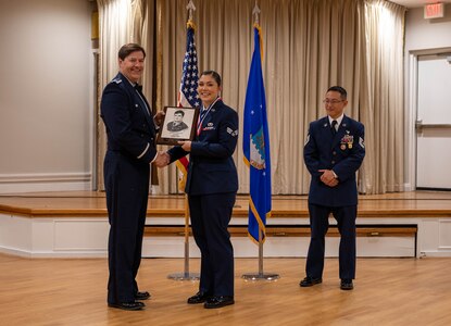 U.S. Air Force Col. John G. Thorne, 363d Intelligence, Surveillance and Reconnaissance Wing vice commander awards U.S. Air Force Senior Airman Shelby Hawkins, 17th Intelligence Squadron production manager with the Langley Airmen Leadership School John L. Levitow Award.