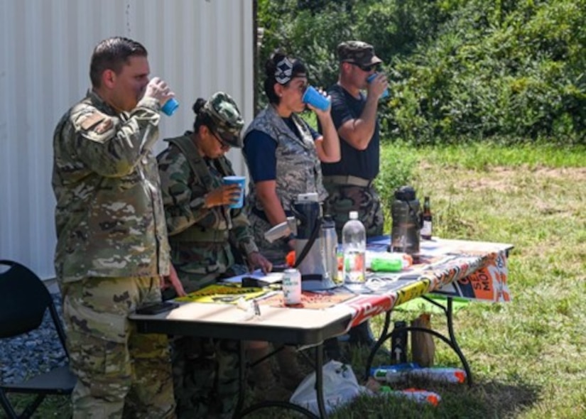 Members of the head table, consisting of leadership from the 633d Security Forces Squadron, drink to a toast during the 633d SFS combat dining out at Joint Base Langley-Eustis, Virginia, Aug. 26, 2022.