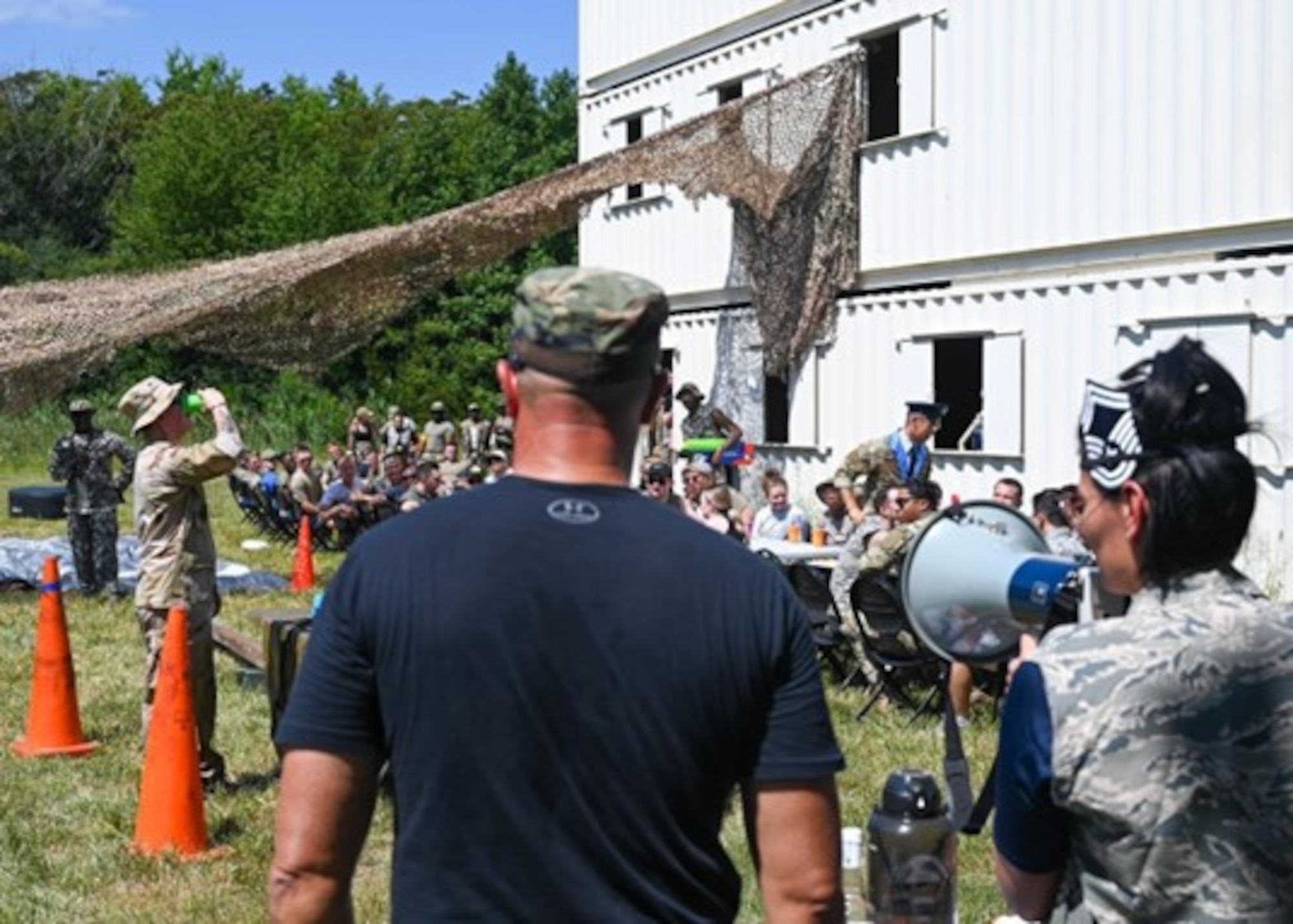 A member of the 633d Security Forces Squadron traverses the obstacle course during the 633d SFS combat dining out at Joint Base Langley-Eustis, Virginia, Aug. 26, 2022.