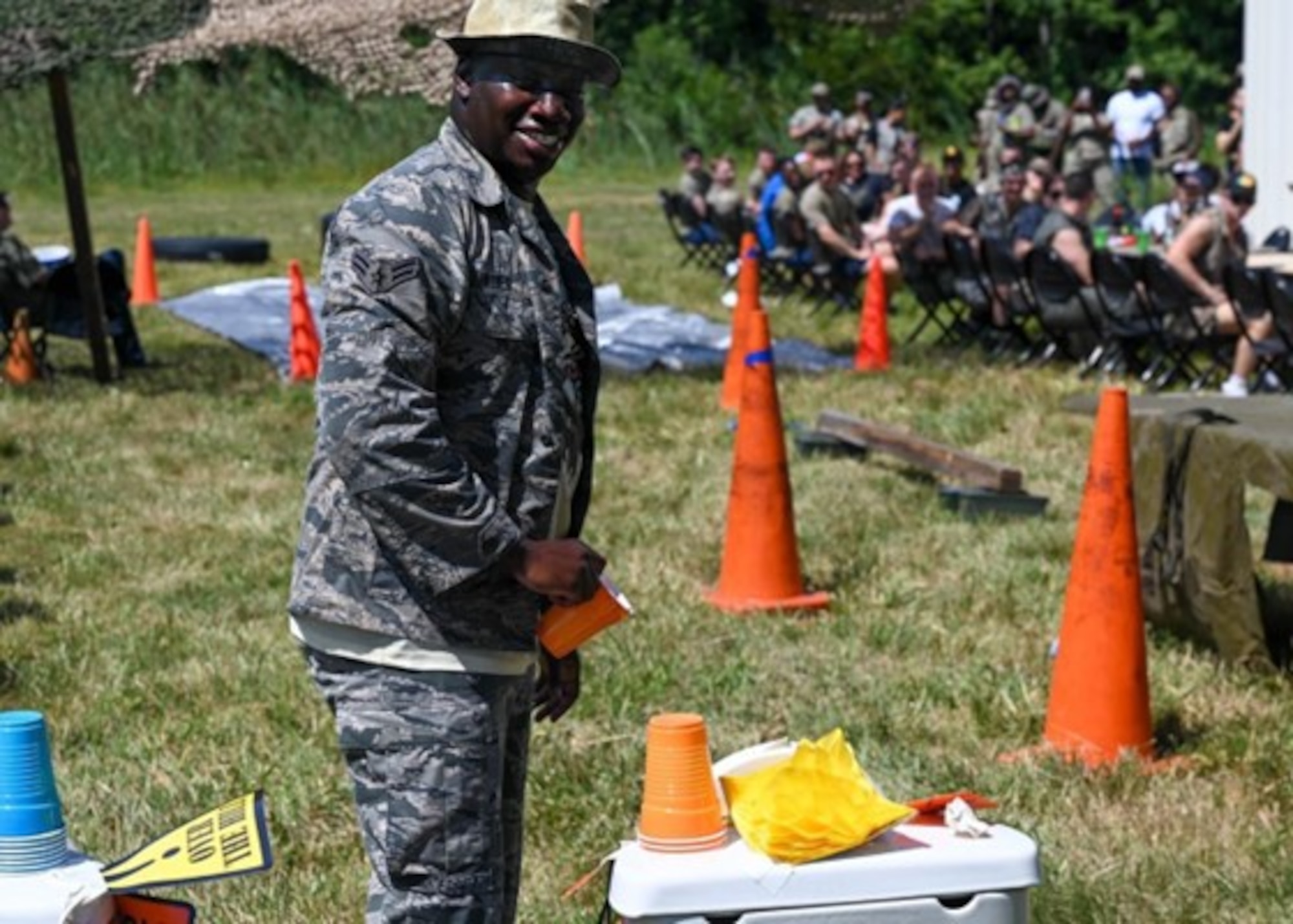 Senior Airman Twagirayesu Adier, 633d Security Forces Squadron response force leader, prepares to drink from the grog bowl during the 633d SFS combat dining out at Joint Base Langley-Eustis, Virginia, Aug. 26, 2022.