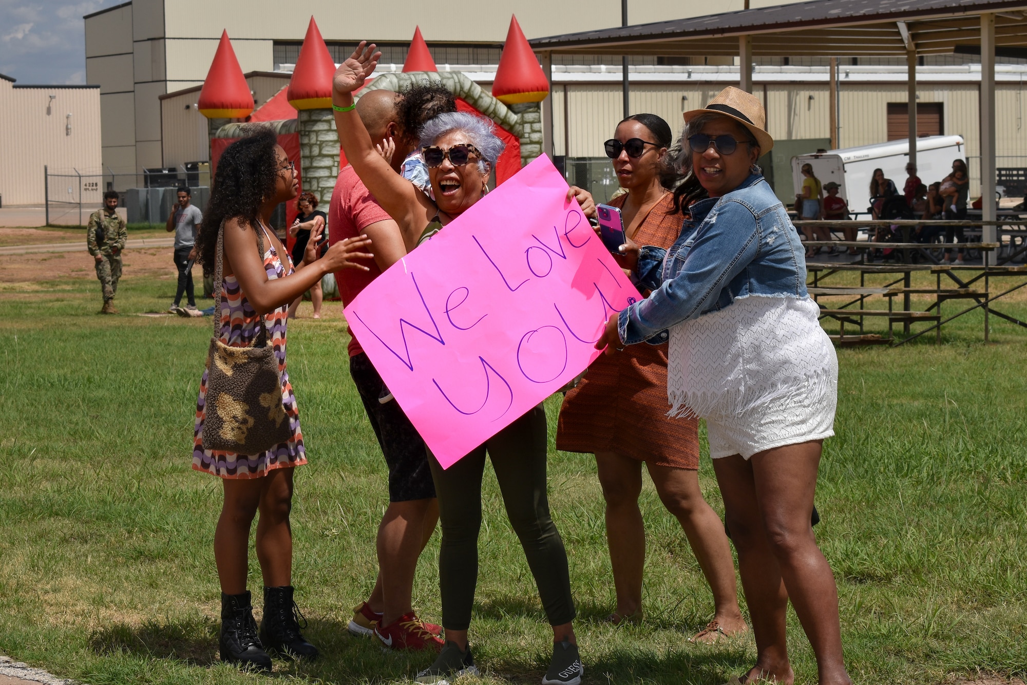 A Dyess loadmaster’s family waves goodbye to the aircraft before they depart for a deployment to CENTCOM Aug. 26, 2022. This family traveled from Colorado in order to wish their deployer well on her deployment. The C-130 unit’s deployment to U.S. Central Command marks the first implementation of the Air Force Generation model in Air Mobility Command. (U.S. Air Force photo by 1st Lt. Kaitlin Cashin)