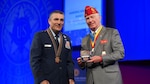Maj. Gen. Paul Knapp accepts the 2022 American Legion National Education Award on behalf of the National Guard Bureau at The American Legion 103rd National Convention at the Milwaukee Center in Milwaukee Aug. 31, 2022. The award was presented for the National Guard Youth ChalleNGe program, which helps “at-risk” teens earn their high school diploma or GED.