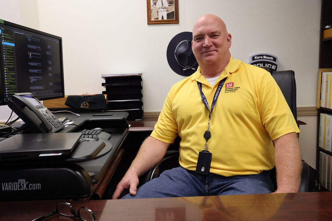 Greg Barr, U.S. Army Corps of Engineers Mobile District’s Chief of Security, poses for a photo at his desk on Aug. 31, 2022, in Mobile, Alabama. Barr said that complacency is the main thing employees need to be mindful of to avoid security incidents. (U.S. Army photo by Chuck Walker)