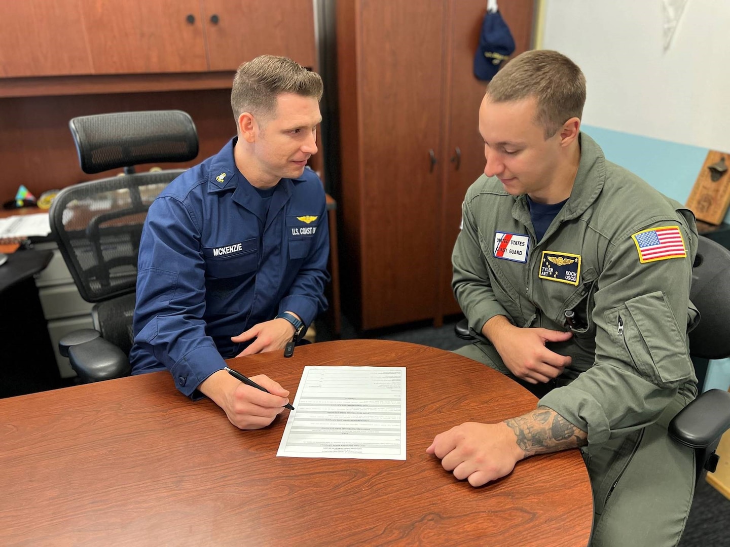 Chief Petty Officer Charles McKenzie, an avionics electrical technician at Air Station Sacramento, counsels recent arrival, Petty Officer 2nd Class Tyler Koch on his Individual Development Plan (IDP).  McKenzie says having direct reports complete an IDP once they get settled is a good way for commanders to get to know their new unit.