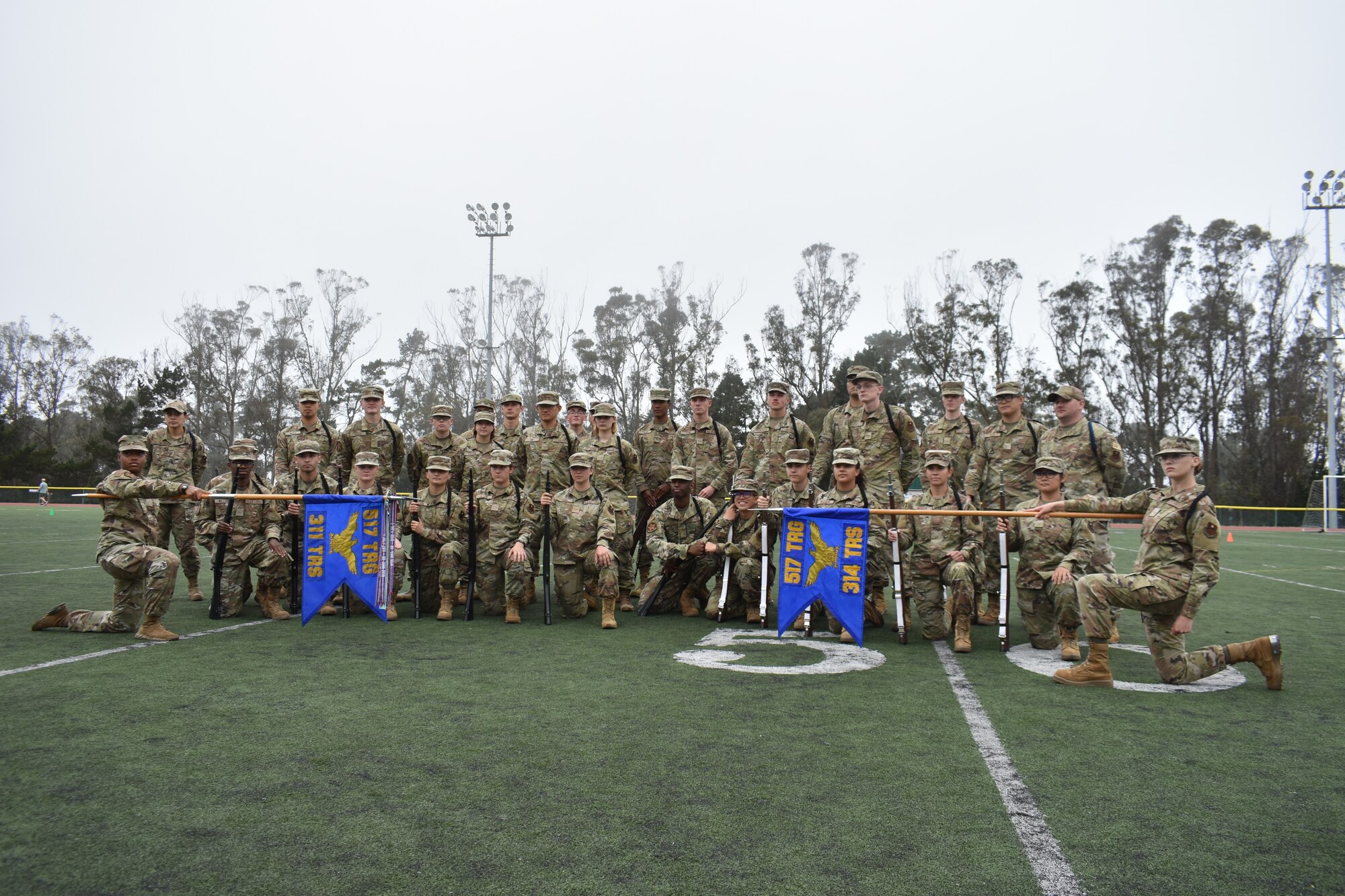 The 314th and 311th Training Squadron drill teams pose for a photo before the 2022 Drill Down competition at the Price Fitness Center, Presidio of Monterey, Calif., Aug. 19, 2022. Drill teams were inspected on their ability to perform standard and exhibition drill. (Courtesy photo 517th TRG)