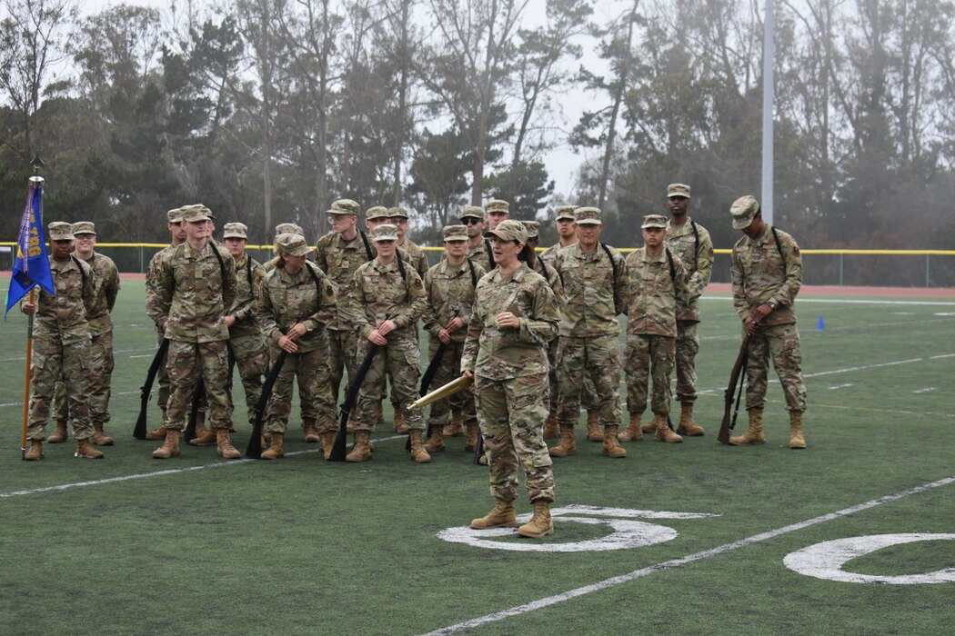 U.S. Col. Jennifer Saraceno, 517th Training Group commander, presents the golden rifle to the 314th Training Squadron team following the 2022 Drill Down competition at the Price Fitness Center, Presidio of Monterey, Calif., Aug. 19, 2022. The golden rifle was presented to the winning team that performed best across all categories of standard and exhibition drill. (Courtesy photo 517th TRG)