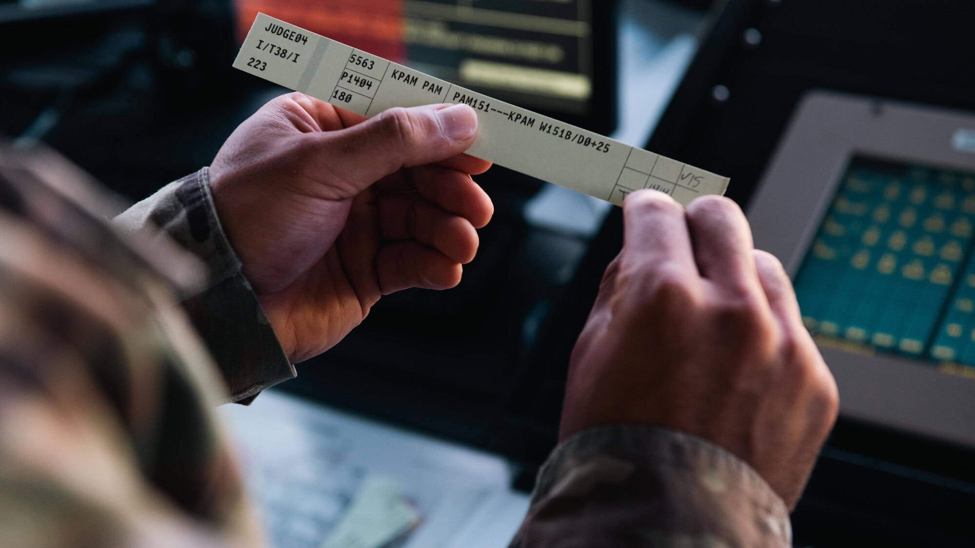 Airmen inspects a document.