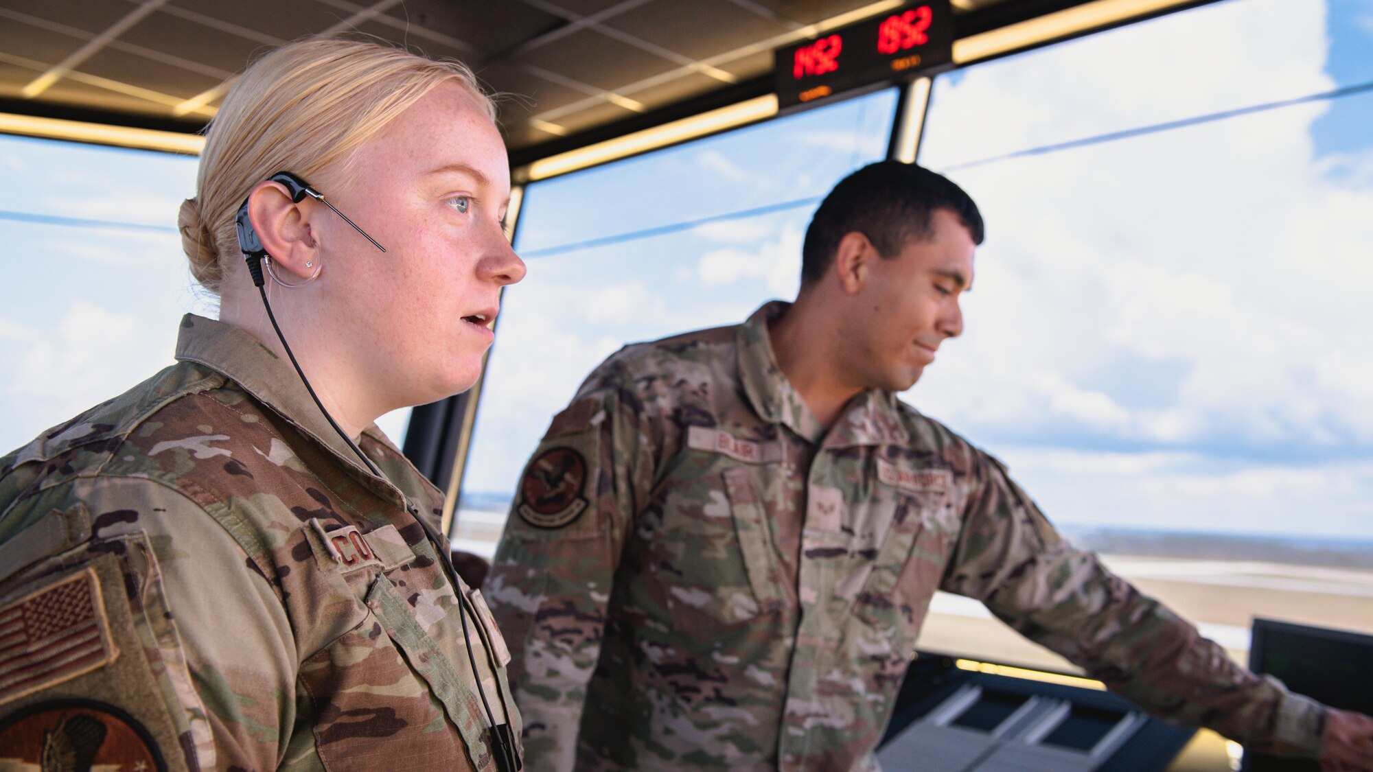 Airman talks on a headset.