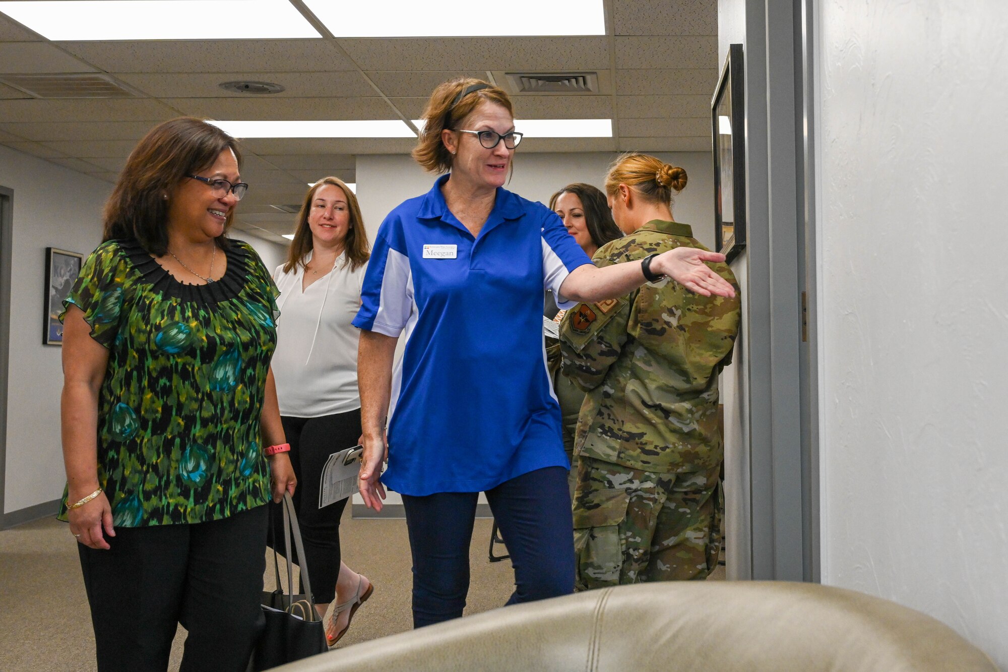 Meegan Kriley-Mackay, creative education organizer, shows Maureen Robinson, spouse of Lt. Gen. Brian Robinson, commander of Air Education and Training Command, the military spouse co-working space at Altus, Oklahoma, Aug. 31, 2022. Base and community leaders created the area to give professionals the space and resources they need to conduct business while also serving as military spouses. (U.S. Air Force photo by Airman 1st Class Trenton Jancze)