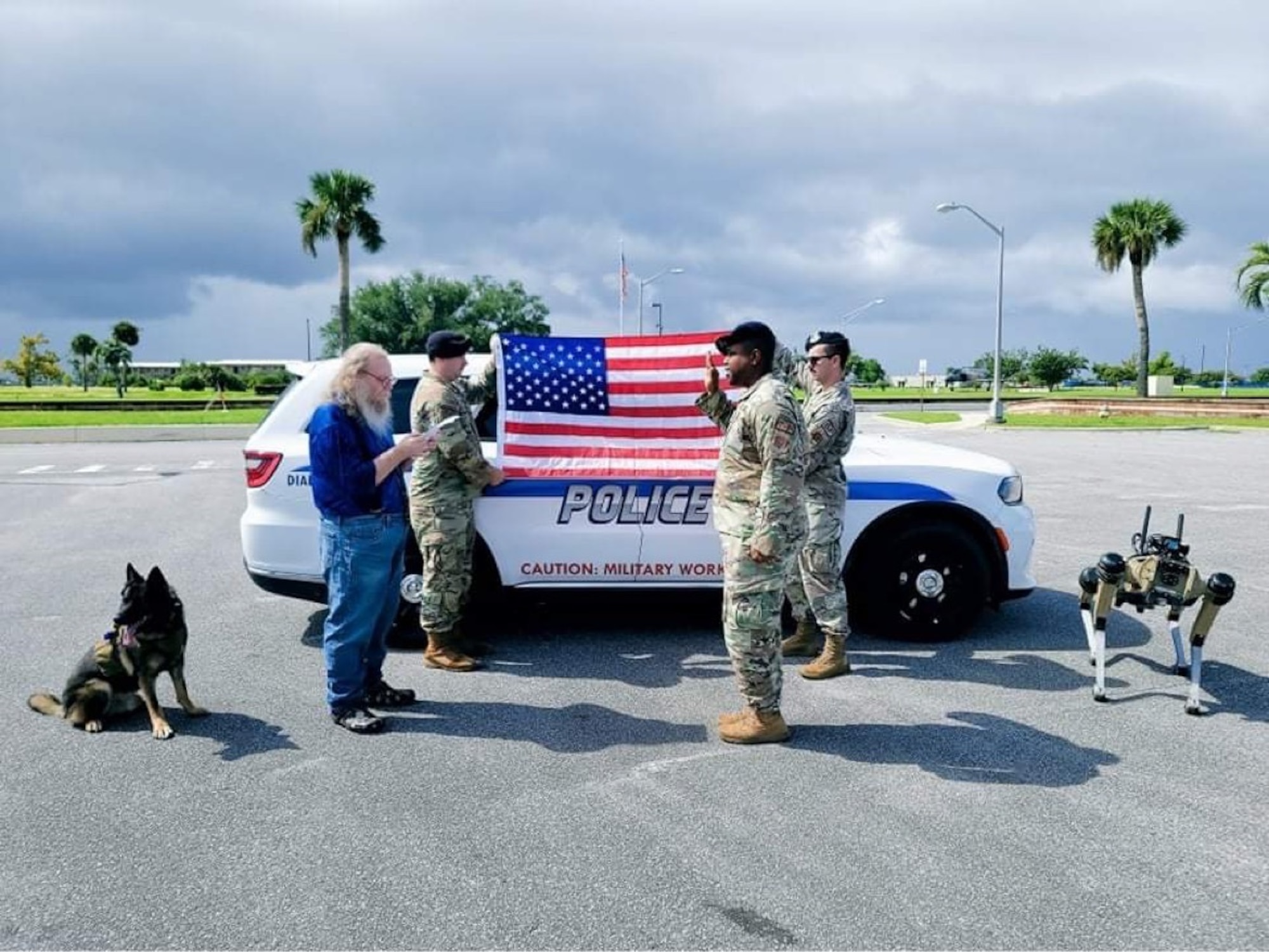Retired U.S. Air Force Lt. Col. Daniel Coshatt, left, administers the oath of enlistment to Tech. Sgt. Billy Lofton, 325th Security Forces Squadron noncommissioned officer in charge of plans, at Tyndall Air Force Base, Florida, Aug. 12, 2022.