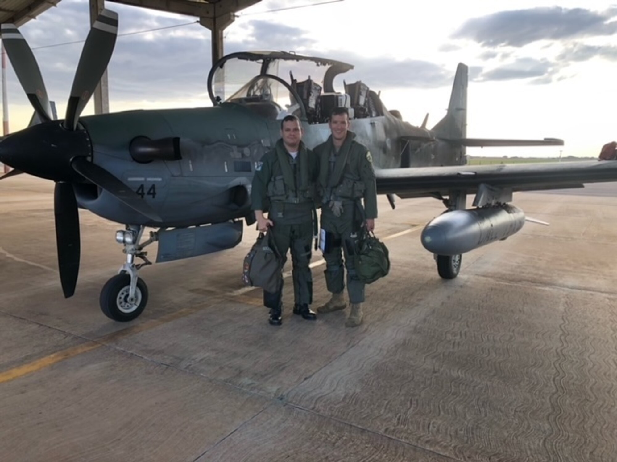 U.S. Air Force Lt. Col. Daniel Griffin, an A-10C Thunderbolt II pilot assigned to the 104th Fighter Squadron, Maryland Air National Guard, poses for a photograph with a pilot from the Brazilian Air Force during Exercise Tapio in Campo Grande, Brazil, August 24, 2022.