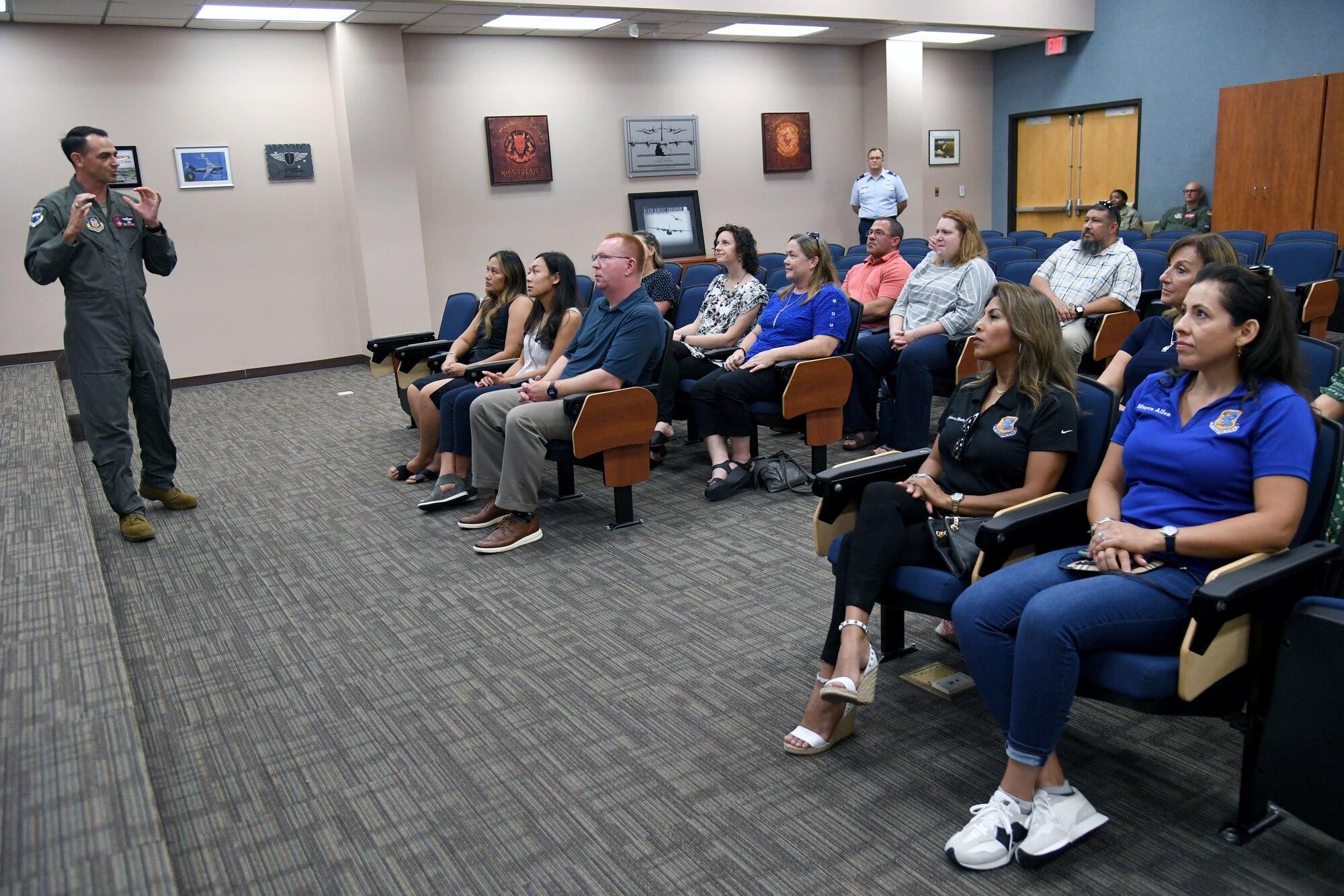 U.S. Air Force Col. Stuart Rubio, 403rd Wing commander, delivers a mission brief to Keesler key spouses and spouses of base leadership inside the 815th Airlift Squadron building at Keesler Air Force Base, Mississippi, Aug. 31, 2022. The spouses also toured a C-130J aircraft, the Keesler Medical Center, the Fisher House and received a military working dog demonstration. (U.S. Air Force photo by Kemberly Groue)