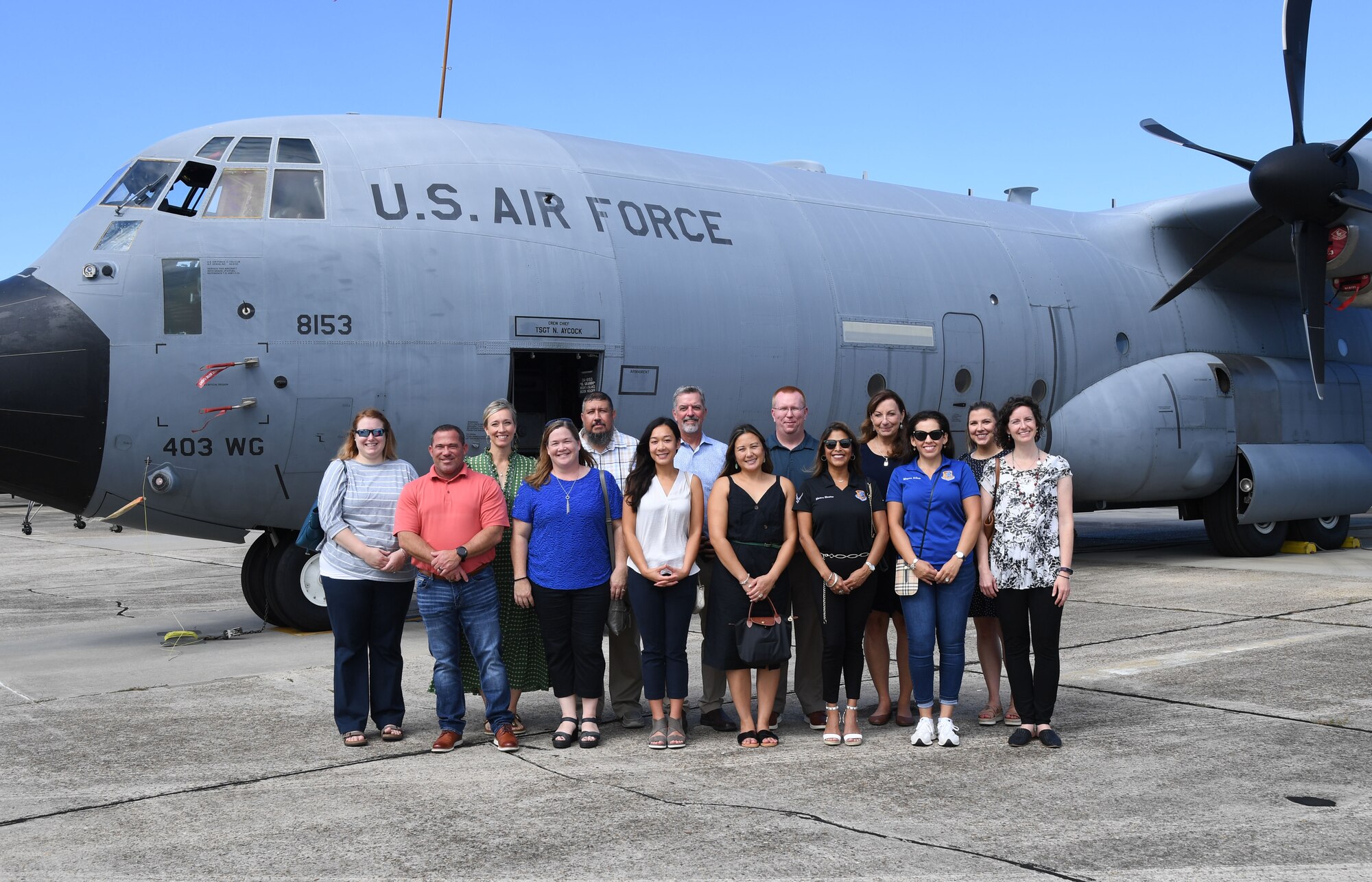 Keesler key spouses and spouses of base leadership pose for a group photo in front of a C-130J aircraft at Keesler Air Force Base, Mississippi, Aug. 31, 2022. The spouses also toured the Keesler Medical Center and the Fisher House and received a military working dog demonstration. (U.S. Air Force photo by Kemberly Groue)