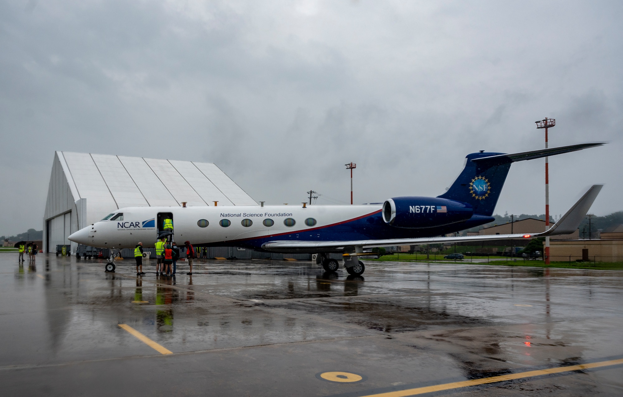 National Center for Atmospheric Research (NSF/NCAR) scientists and researchers disembark from a Gulfstream-V N677F aircraft at Osan Air Base, Republic of Korea, July 31, 2022.