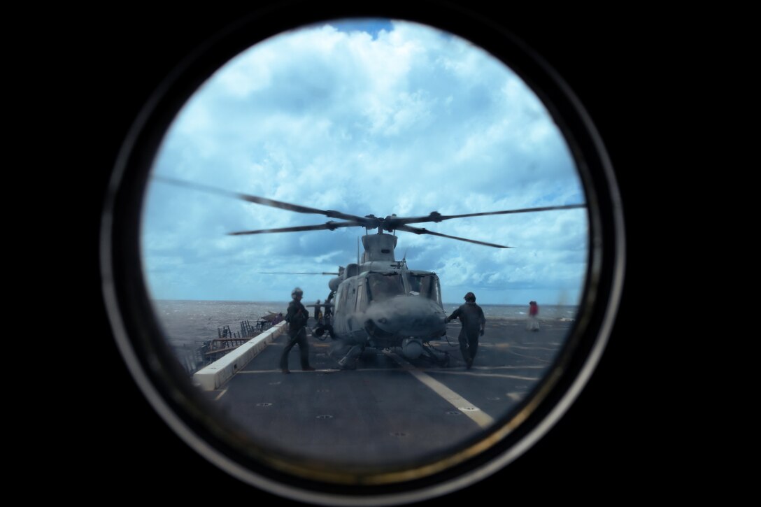 A U.S. Marine Corps UH-1Y Venom helicopter assigned to Light Attack Helicopter Squadron (HMLA) 773 sits on the landing pad of the San Antonio class dock landing ship USS Mesa Verde (LPD 19) in the North Atlantic Ocean, Aug. 16, 2022. HMLA 773 launched three UH-1Y Venom and two AH-1Z Viper helicopters from McGuire Air Force Base and embarked them aboard the USS Mesa Verde for transit to Brazil in support of exercise UNITAS LXIII hosted by the Brazilian Navy and Marine Corps. UNITAS, which is Latin for “unity,” was conceived in 1959 and has taken place annually since first conducted in 1960. This year marks the 63rd iteration of the world’s longest-running annual multinational maritime exercise. Additionally, this year Brazil will celebrate its bicentennial, a historical milestone commemorating 200 years of the country’s independence.