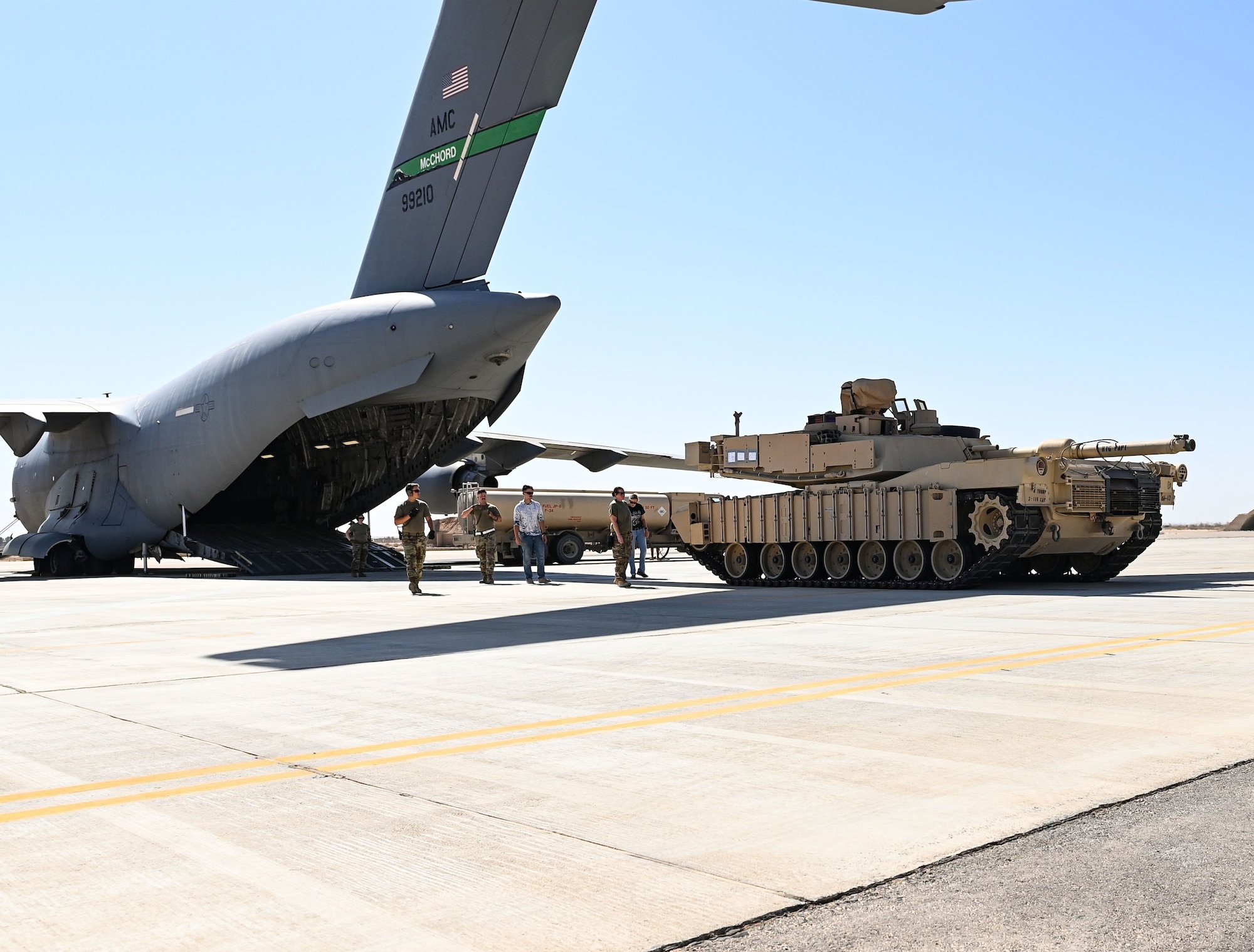 An M-1/A2 Abrams main battle tank rolls out of a C-17 Globemaster III aircraft operated by the 816th Expeditionary Airlift Squadron, Aug 27, 2022 at an undisclosed location. The 816th EAS hauls cargo and personnel across the Air Forces Central area of responsibility. (U.S. Air National Guard photo by Master Sgt. Michael J. Kelly)