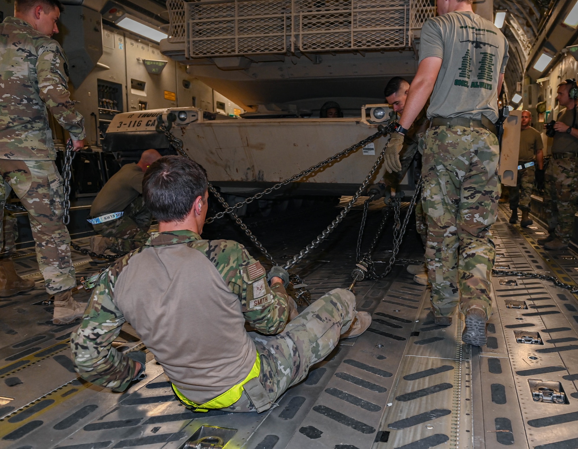 Airmen from the 386th Expeditionary Logistics Readiness Squadron alongside 816th Expeditionary Airlift Squadron loadmasters secure an M-1/A2 Abrams main battle tank aboard a C-17 Globemaster III aircraft Aug 12, 2022 at Ali Al Salem Air Base, Kuwait. The M-1 Abrams tank requires 38 chains to be securely fastened during flight. (U.S. Air National Guard photo by Master Sgt. Michael J. Kelly)