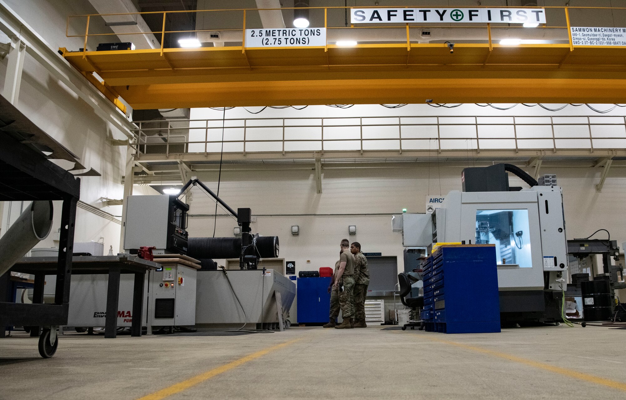 Airmen with the 8th Maintenance Squadron aircraft metals technology flight watch fabrication machines work at Kunsan Air Base, Republic of Korea, Aug. 26, 2022. The flight is certified to operate computer-aided machinery, welding and digital design programs to provide services to various customers around the base. (U.S. Air Force photo by Staff Sgt. Sadie Colbert)