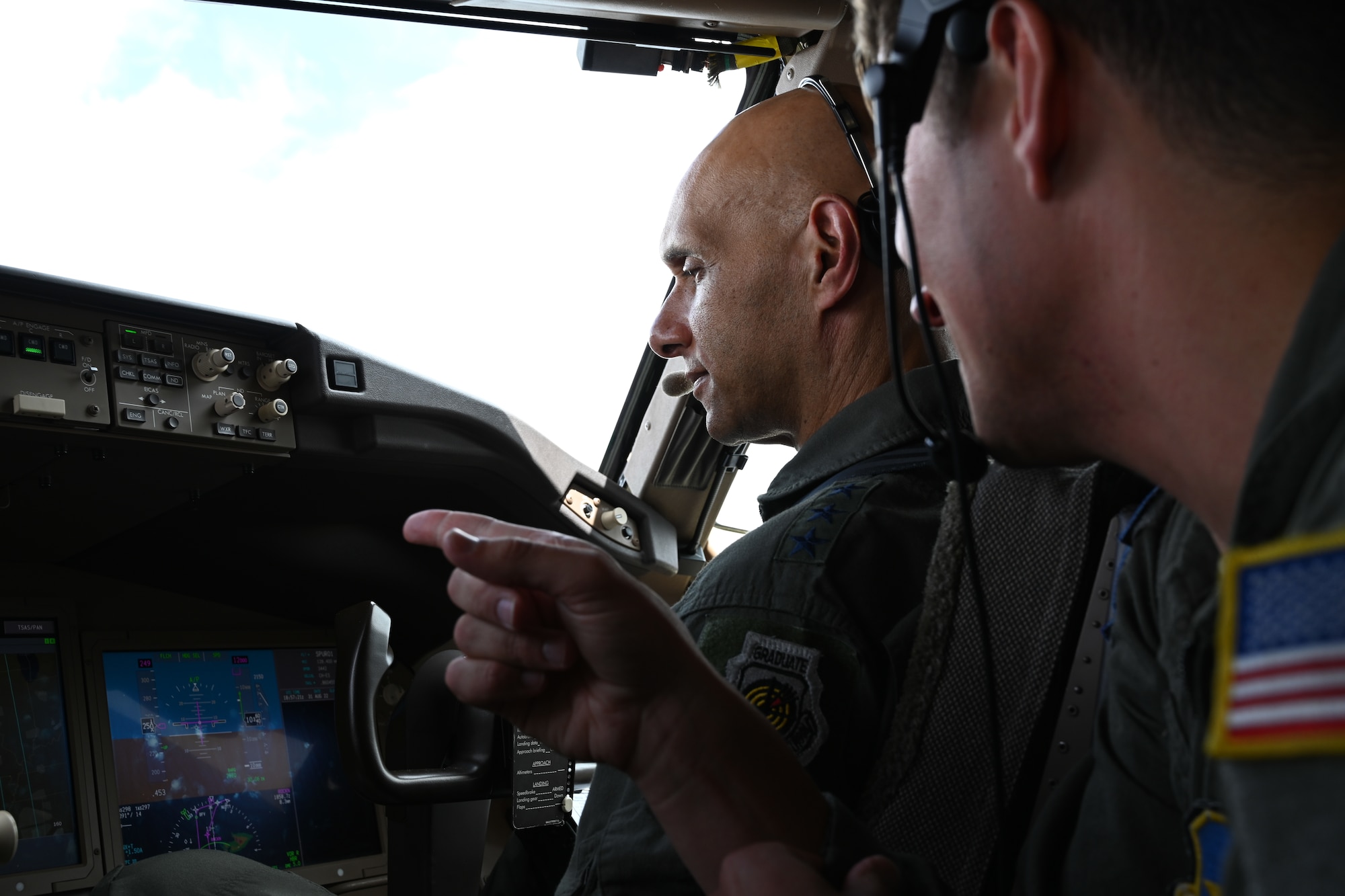 U.S. Air Force Lt. Gen. Brian Robinson, commander of Air Education and Training Command, speaks with Maj. Sean Shanahan, 56th Air Refueling Squadron instructor pilot, while flying a KC-46 Pegasus out of Altus Air Force Base, Oklahoma, Aug. 31, 2022. As part of his tour, Robinson flew the KC-46 to experience what instructors do on a regular basis. (U.S. Air Force photo by Airman 1st Class Miyah Gray)